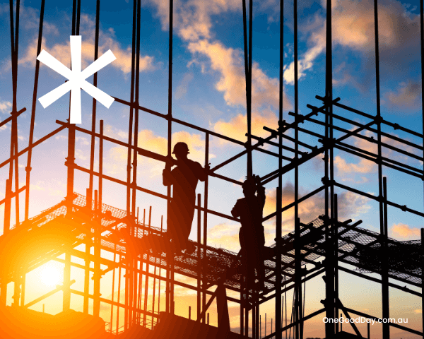 Image is of scaffolding view from the ground looking up to the sky. There are two silhouettes of men in hardhats up on the scaffolding. The sun is bright in the left hand bottom corner. The sky is blue with scattered clouds.
